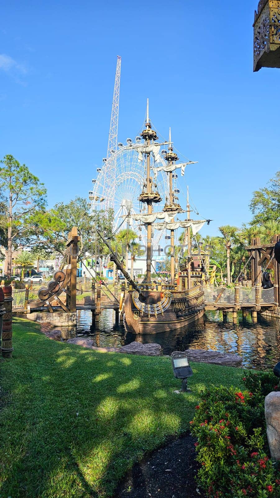 Orlando, FL USA - 12.31.2024: Pirate Ship Adventure Amidst Orlando s Skyline A Whimsical Tourist Attraction Scene.