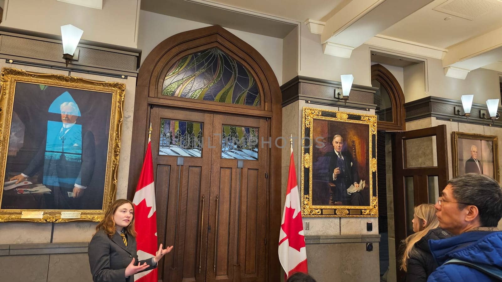 Ottawa, ON Canada - 03.02.2025: Parliament Hill Tour Canadian Flags, Portraits, and Architectural Details in Ottawa, Canada.