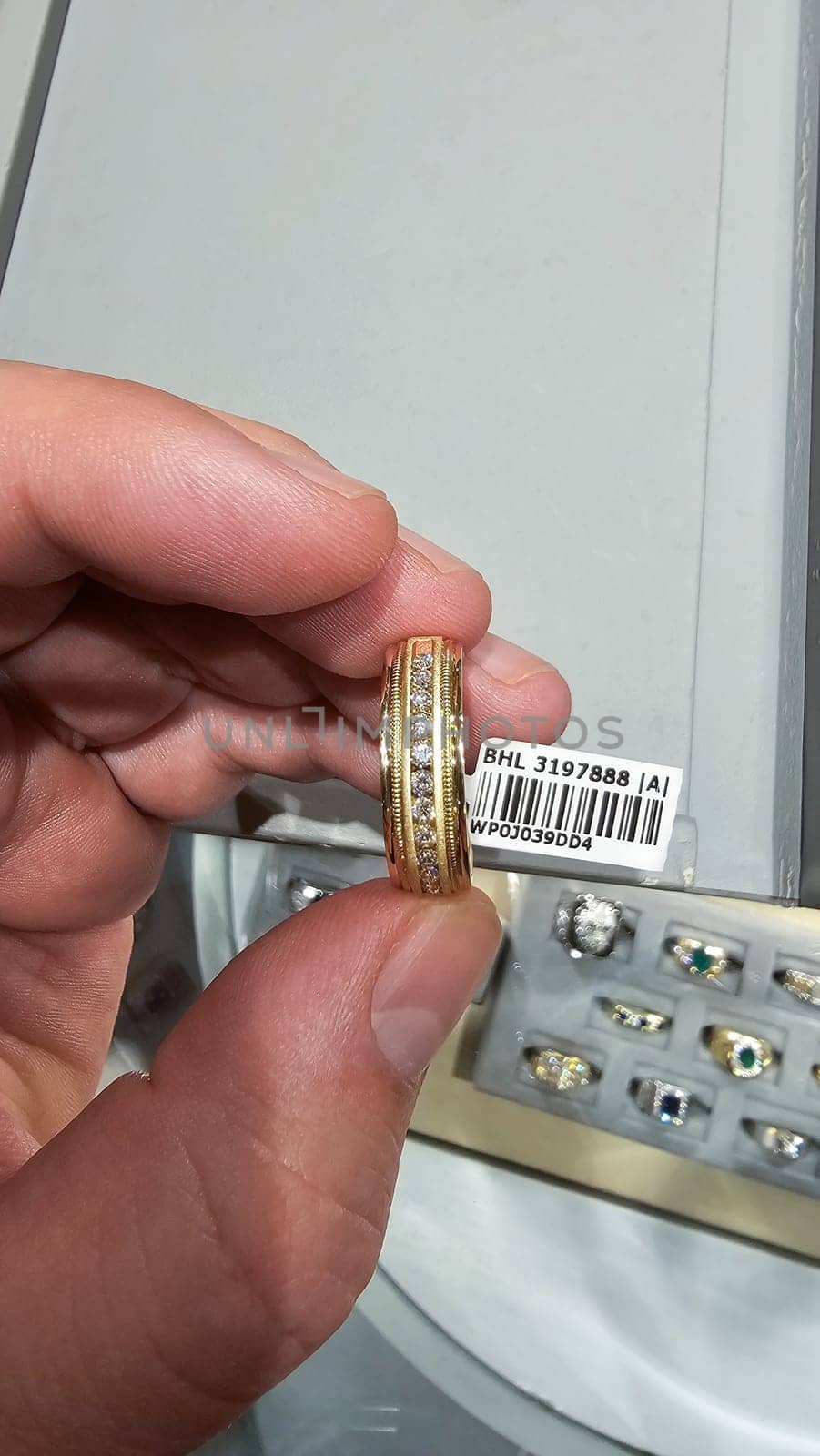 New York, NY USA - 02.12.2024: Elegant Gold Ring Embellished with Diamonds Displayed in Hand, Precious Jewelry Concept.