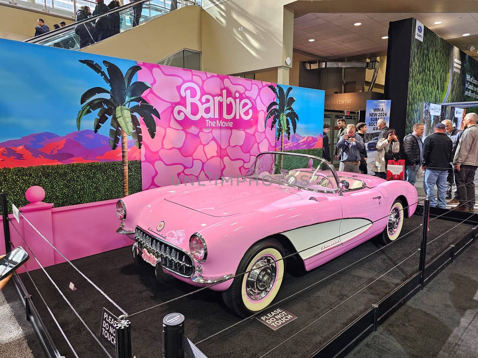 Toronto, ON Canada - 02.23.2024: Classic Pink Barbie Convertible Car Display at an Expo, Nostalgic Automotive Presentation