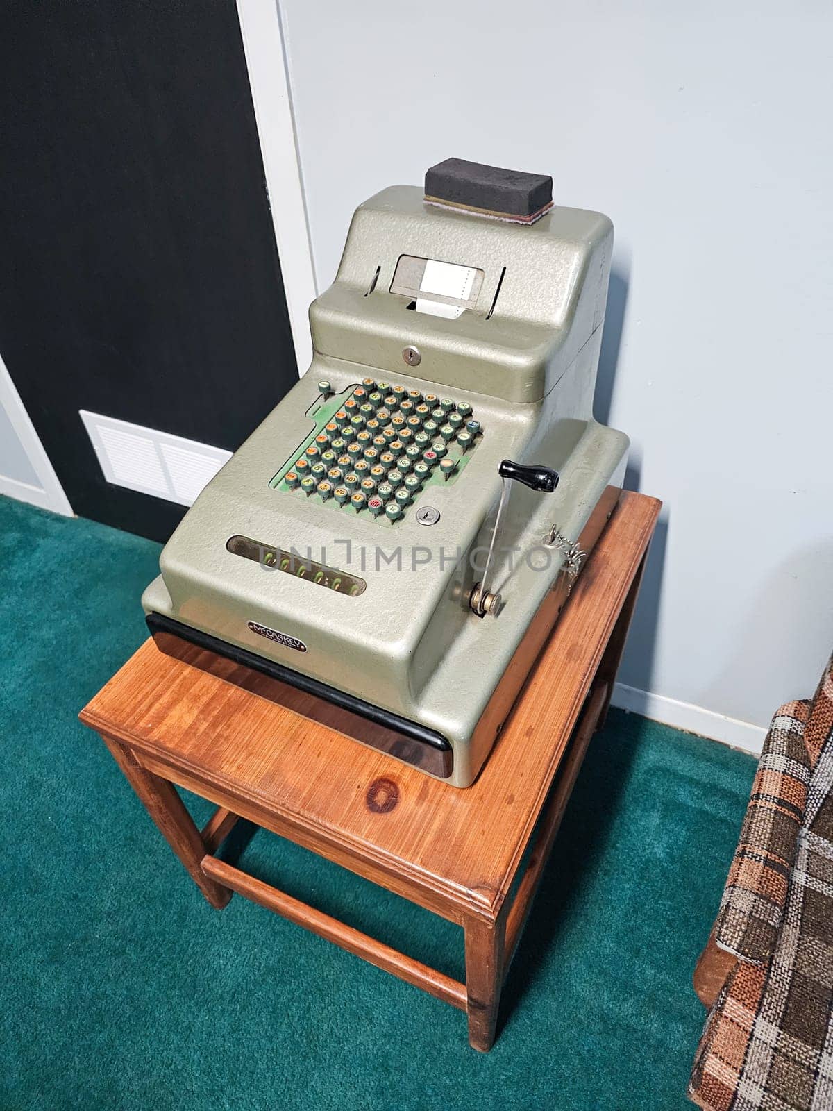Ottawa, ON Canada - 06.15.2024: Vintage Calculator on Wooden Stand A Nostalgic Addition to Any Collection or Display