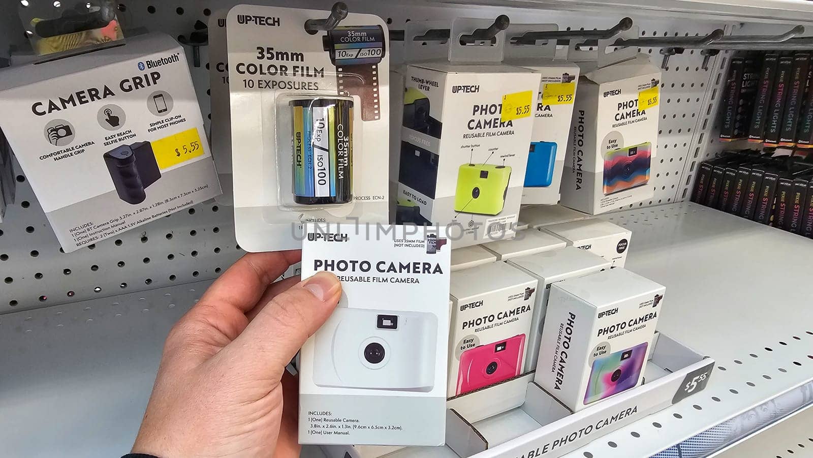 Destin, FL USA - 12.27.2024: Shelf Display of Disposable Cameras and Film Rolls in a Retail Store, Ready for Purchase.
