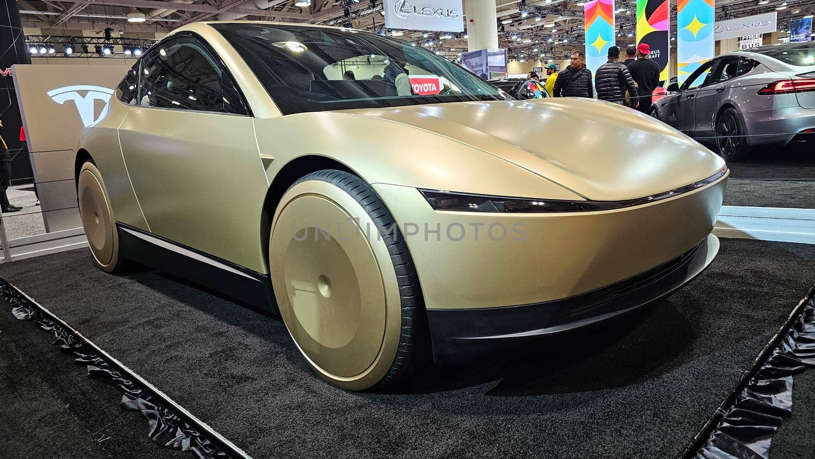 Toronto, ON Canada - 02.16.2025: Sleek Cybercab Tesla Robotaxi Car on Display at Auto Show, Innovative Design and Futuristic Features.
