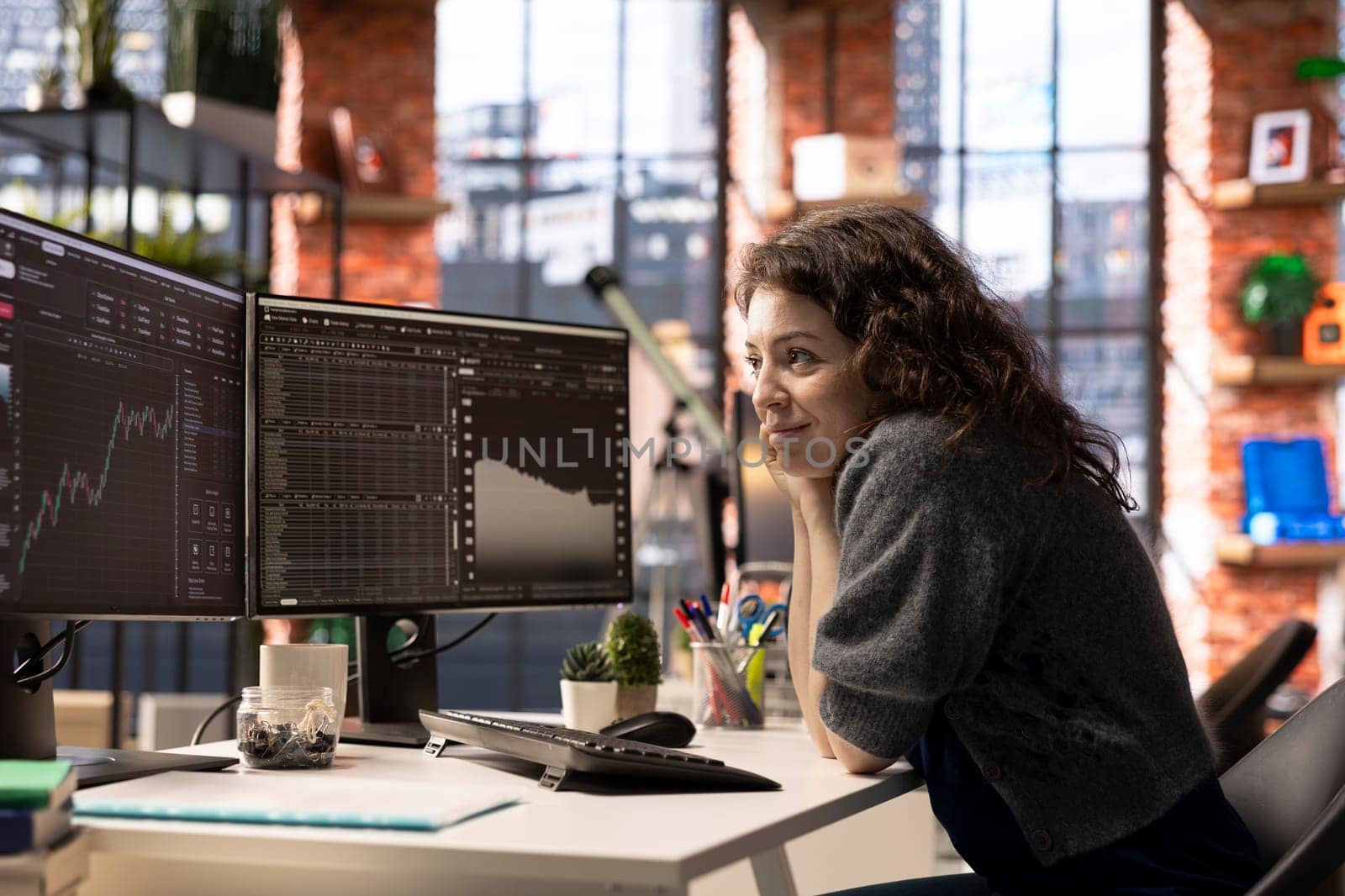 Stock market investor monitors digital charts and candlestick patterns on a financial interface. PC displays trading statistics, make data driven investment decisions and manage risks.