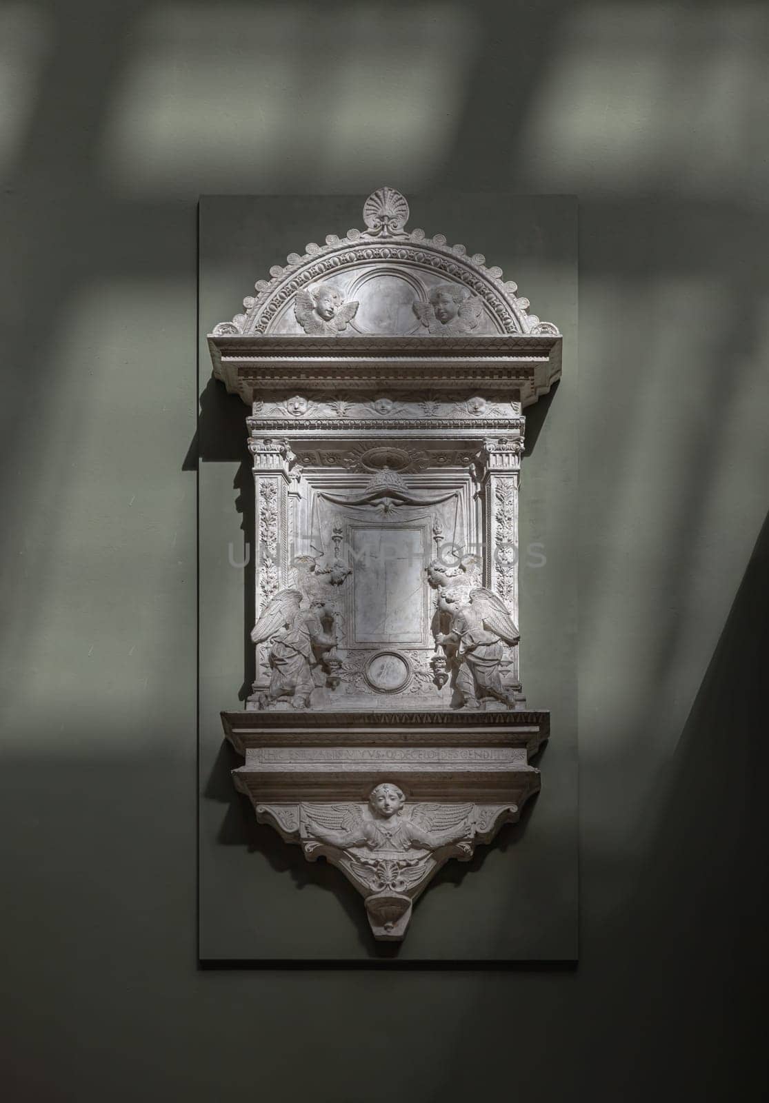 London, UK - May 07, 2025 - Plaster cast of A Marble Tabernacle of The Sacrament from the Church of S. Croce made by Mino da Fiesole displayed in The V&A (Victoria and Albert Museum) in London, use it as your Wallpaper, Poster and Space for text, Selective focus.