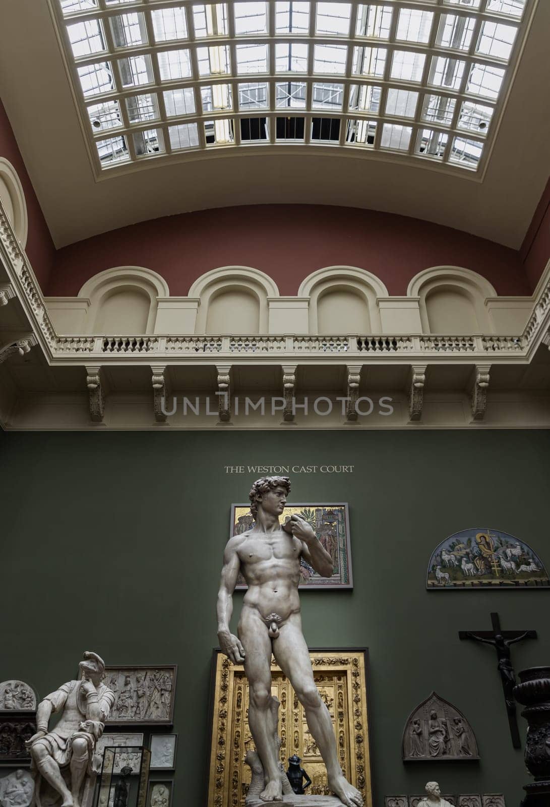 London, UK - May 07, 2025 - London, UK - May 07, 2025 - A magnificent plaster cast of Michelangelo's David sculpture, uses metal rods to support the structure to mount the left and right arms to the torso Displayed in The V&A (Victoria and Albert Museum) in London. use it as your Wallpaper, Poster and Space for text, Selective focus.