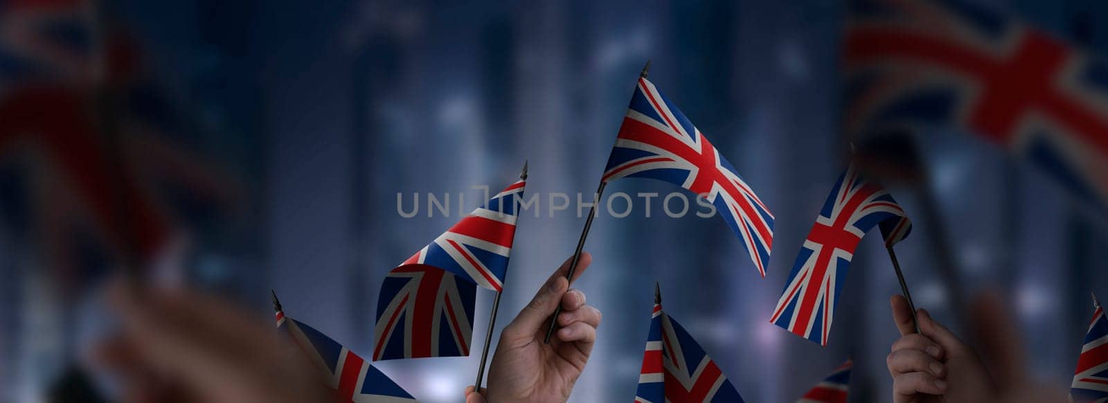 United Kingdom flags in their hands on a blurred urban background. The photo illustration was created without the use of artificial intelligence, only using Photoshop.