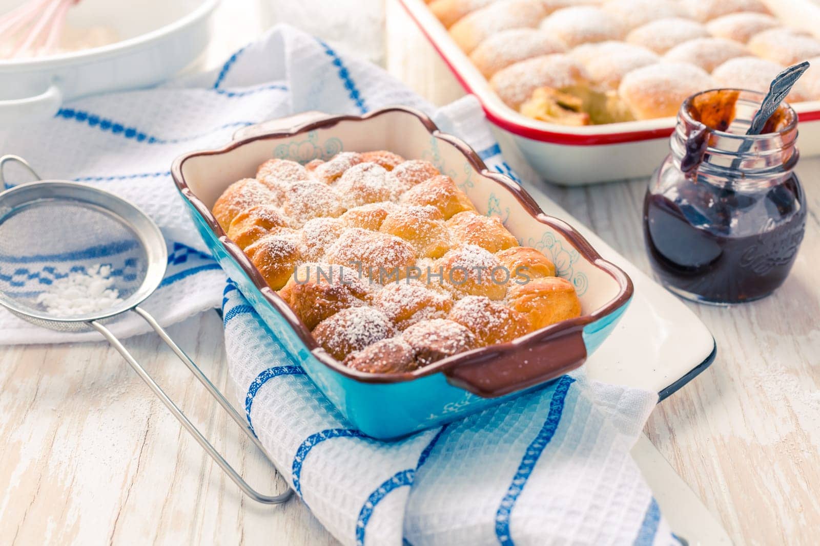 Sweet rolls, Buchteln (buchty) filled with plum jam or jelly with backing ingredients. Typical Czech sweet buns made of yeast dough