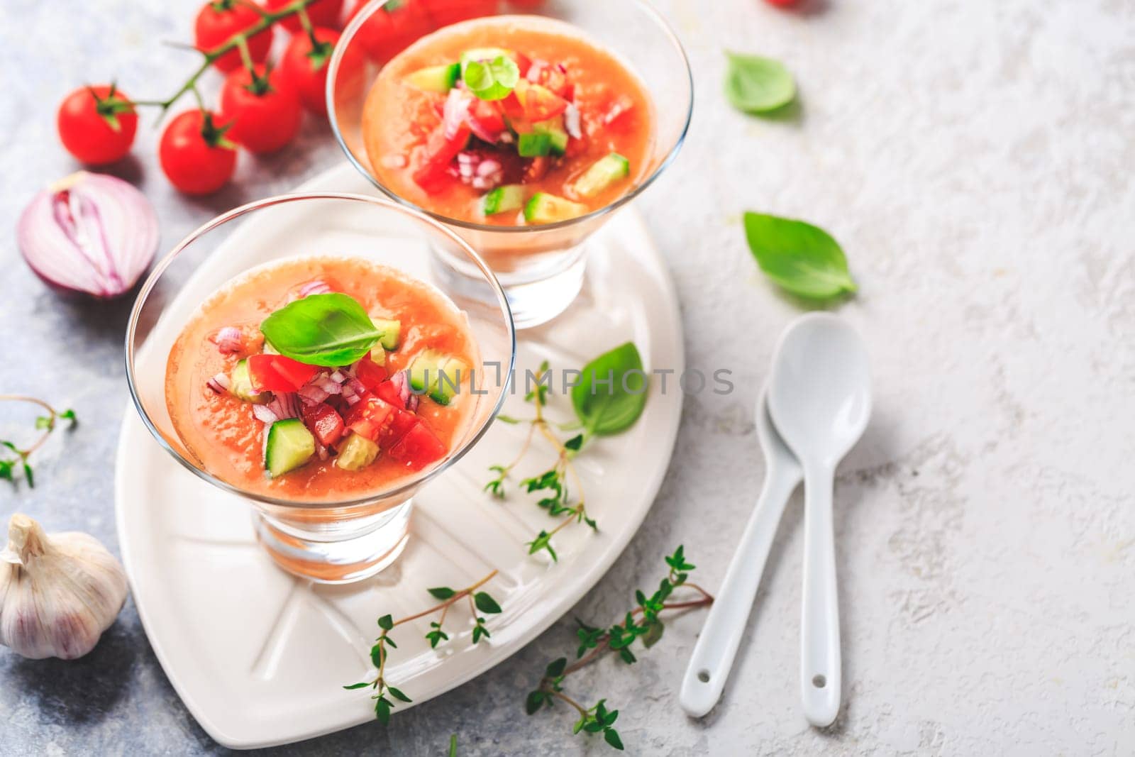 Tomato gazpacho soup with fresh cucumbers. Traditional spanish cold tomato soup of fresh raw vegetables