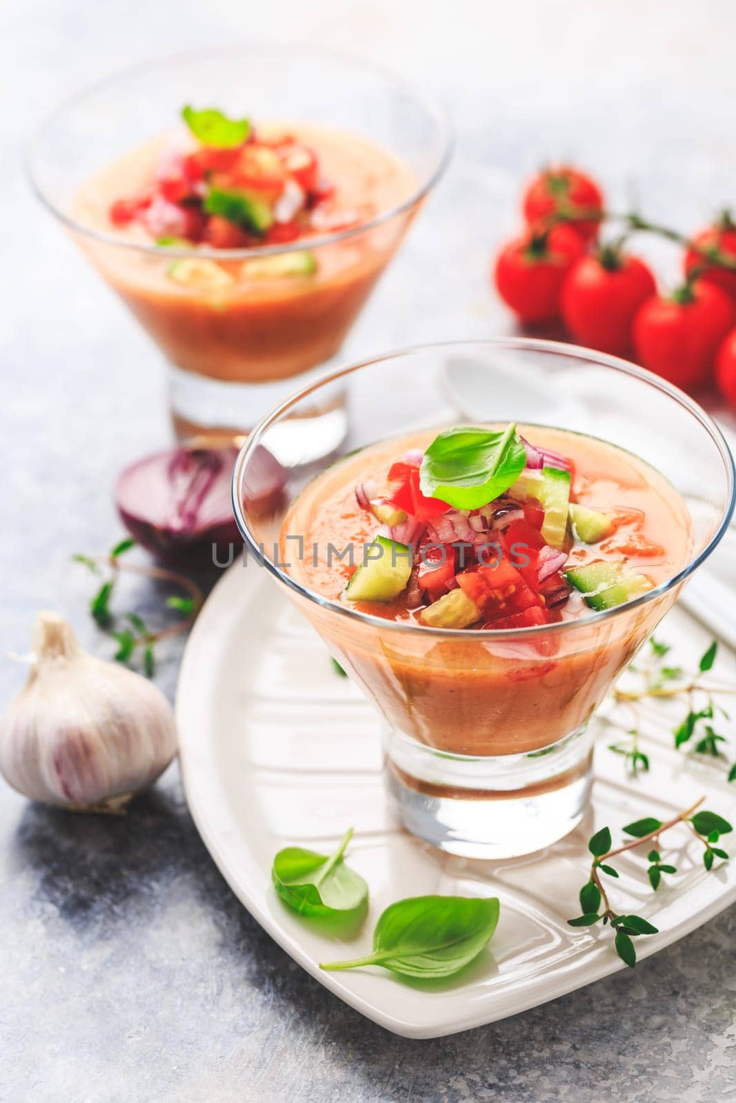 Tomato gazpacho soup with fresh cucumbers. Traditional spanish cold tomato soup of fresh raw vegetables