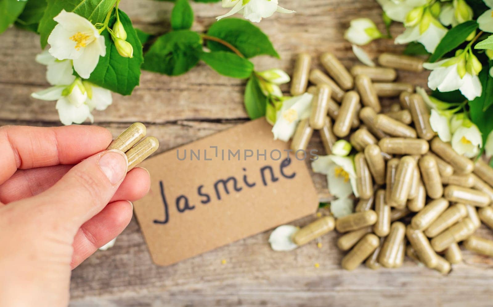 Jasmine essential oil and flowers. Selective focus. nature.