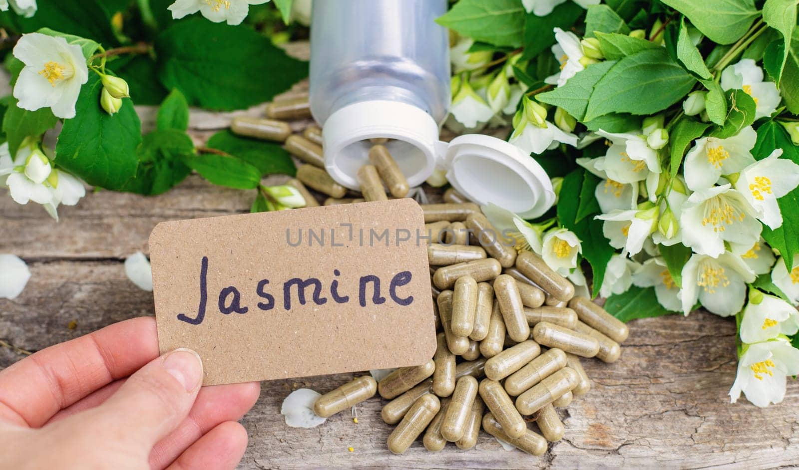 Jasmine essential oil and flowers. Selective focus. nature.