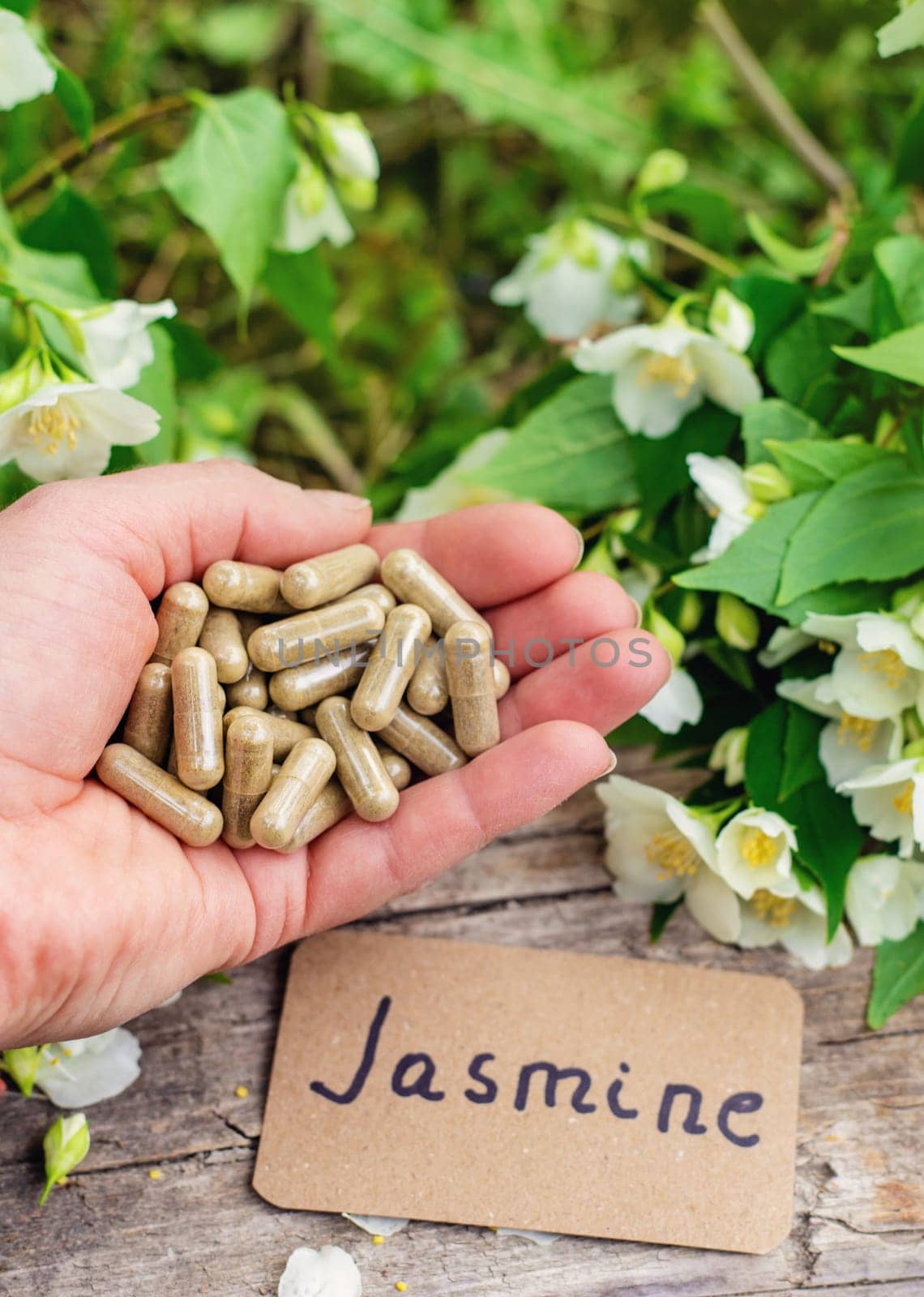 Jasmine essential oil and flowers. Selective focus. nature.