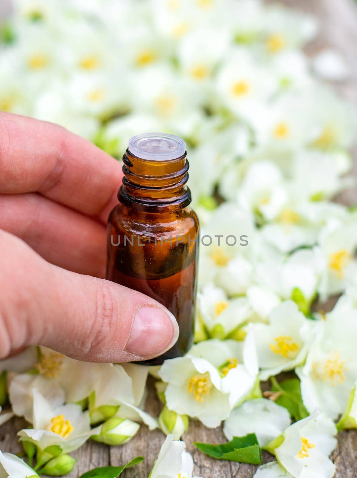 Jasmine essential oil and flowers. Selective focus. nature.