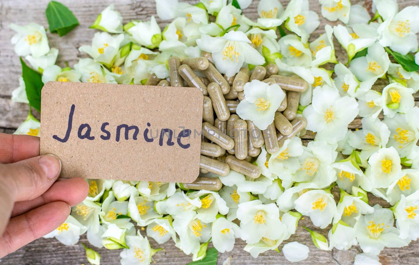 Jasmine essential oil and flowers. Selective focus. nature.