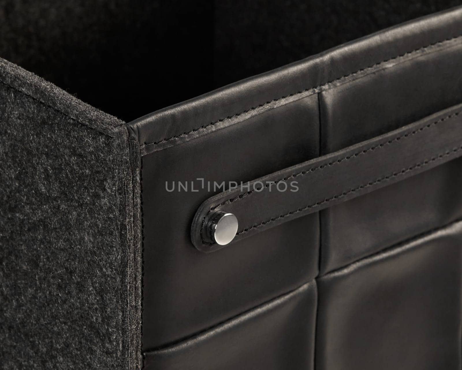 Elegant black leather storage box with a soft felt lining, showcasing refined craftsmanship and a minimalist design