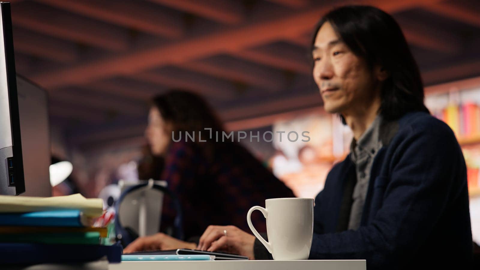 Senior admin working in innovative startup office using programming languages to build application. Experienced software development agency IT CTO supervisor optimizing code on computer, camera B