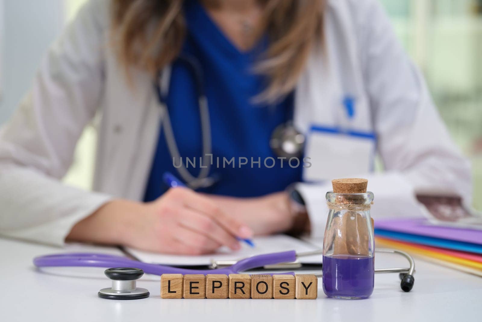 A healthcare professional documenting essential notes on effective leprosy treatment, showcasing their expertise