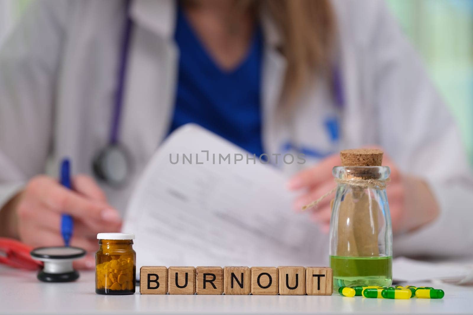 A healthcare professional faces burnout, symbolized by medications and notes, highlighting their path to recovery