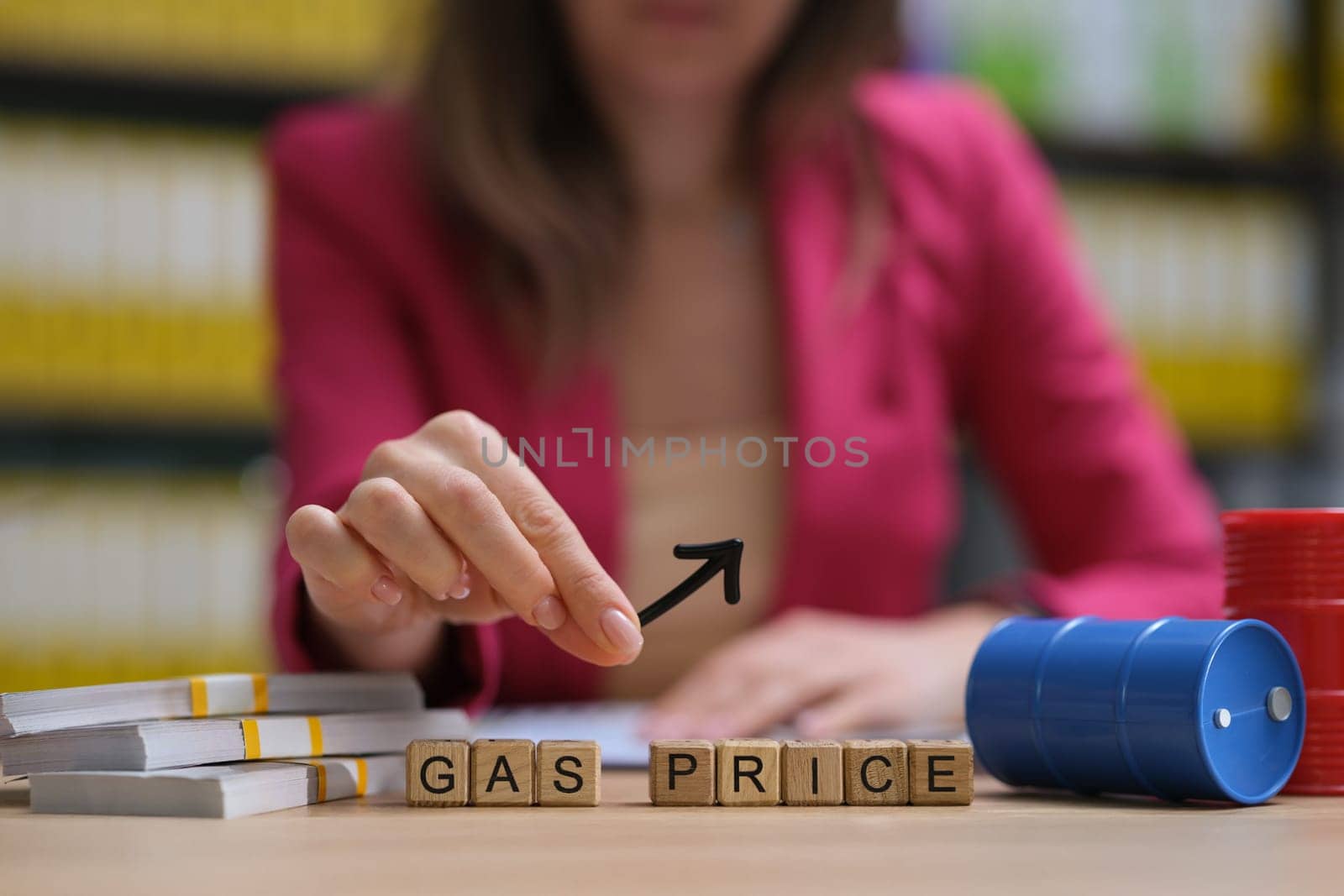 A trained professional is examining current gas prices using advanced analytical tools in a modern workspace