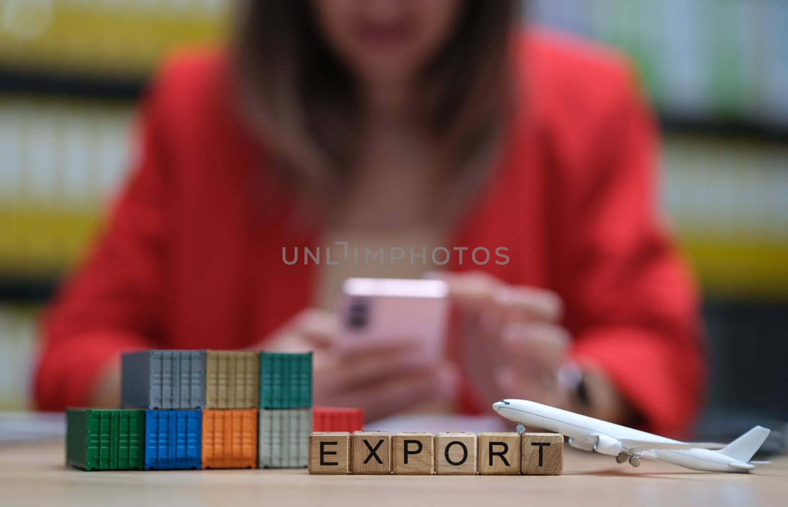 A visual representation of export with blocks, airplane, and mobile phone in a professional setting.