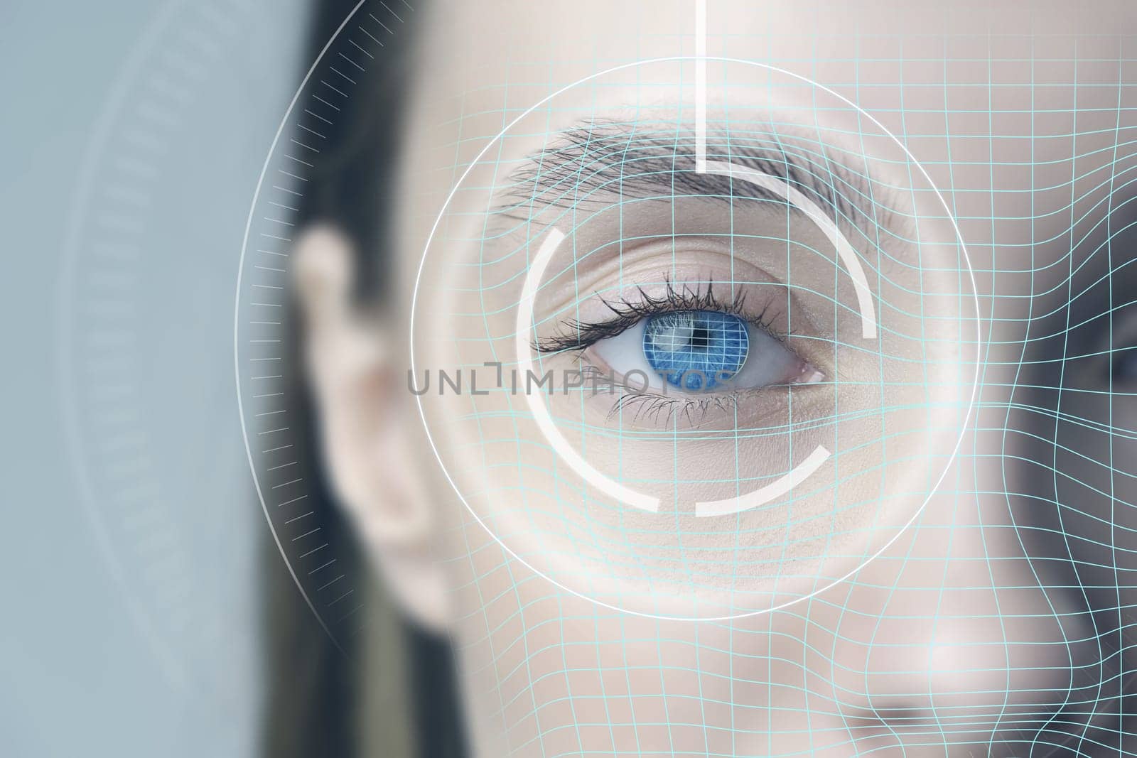 A young woman gazes directly at the camera as a digital overlay appears over her eye, illustrating biometric scanning technology typically used for identification and security purposes.