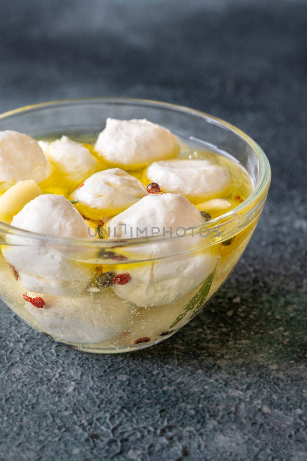 Golden oil swirls around creamy labneh, peppercorns and herbs infuse rustic charm
