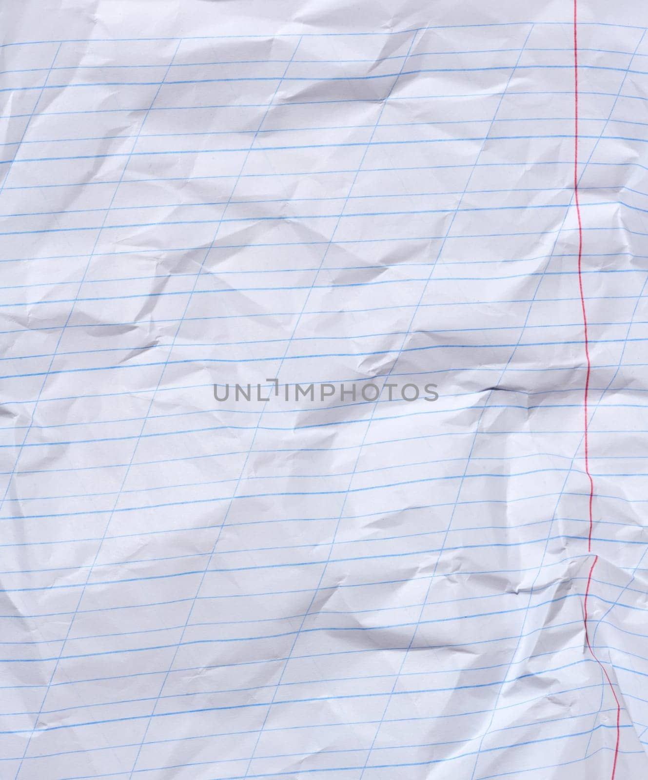 Crumpled sheet of white lined paper with a red border