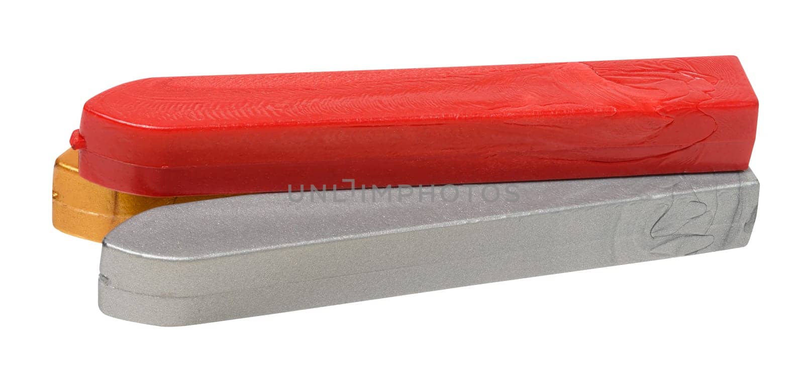 Three sticks of sealing wax in red, gold and silver colors lying on each other, isolated background