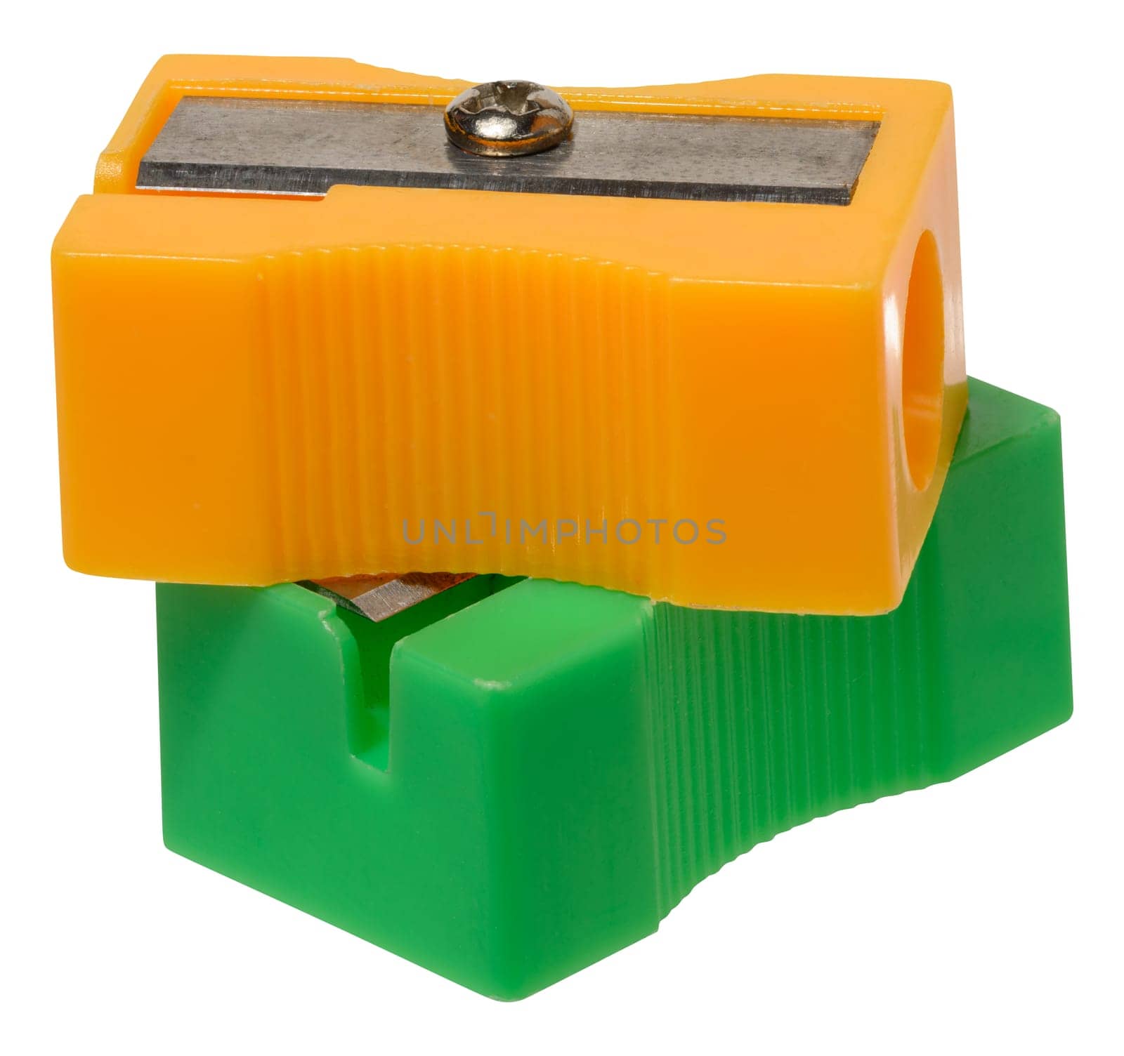 Orange and green plastic pencil sharpeners on isolated background