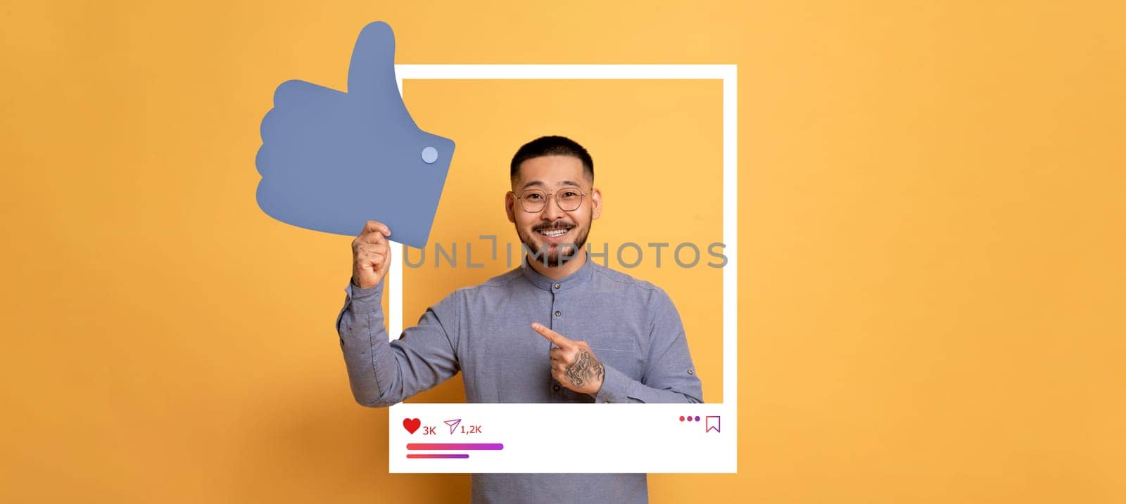 A cheerful content creator poses against a bright orange background, highlighting a thumbs up gesture.