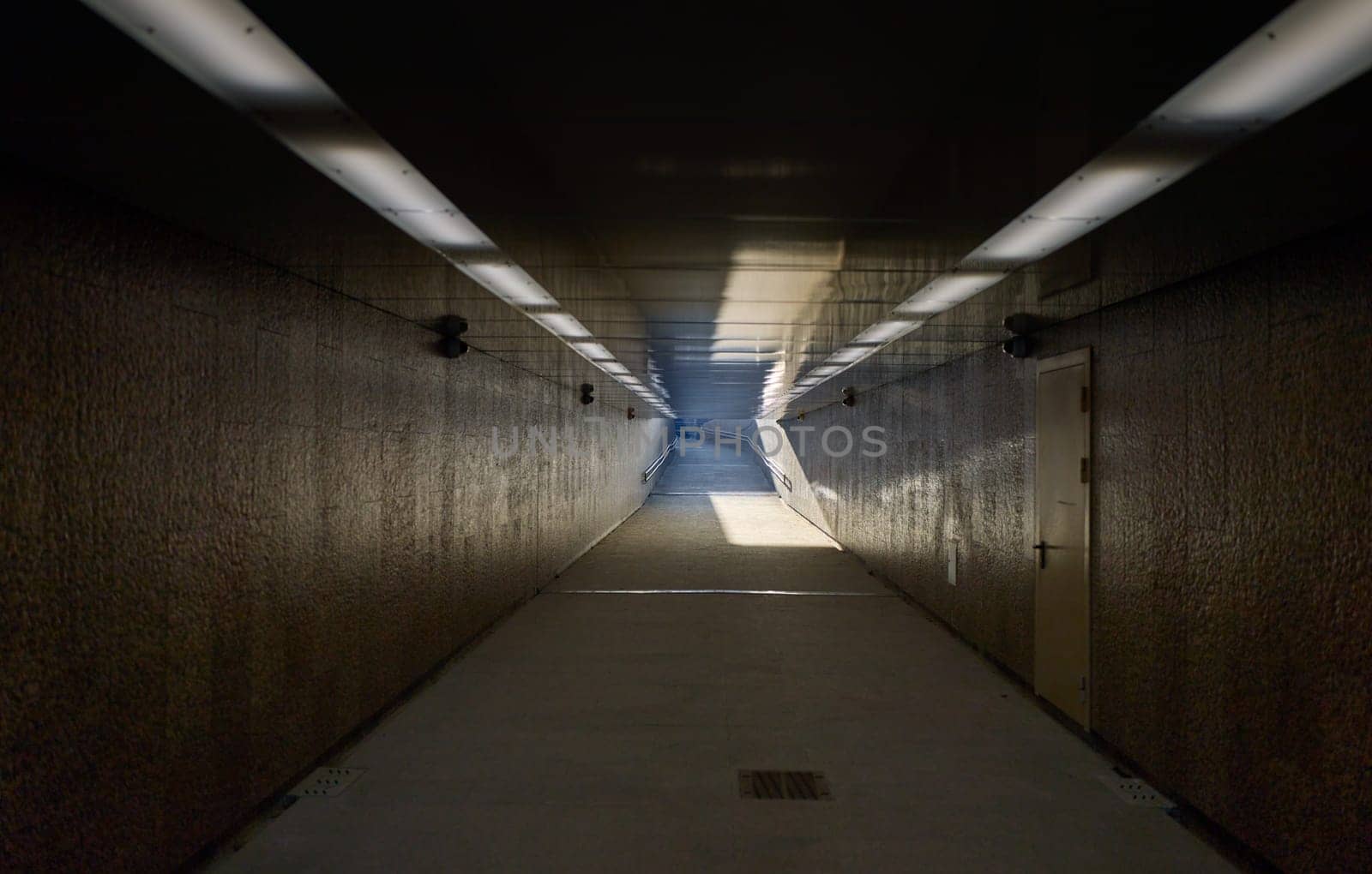 Russia, St. Petersburg, underground passage at birzhevoy bridge, sunlight at the end of the tunnel. High quality photo