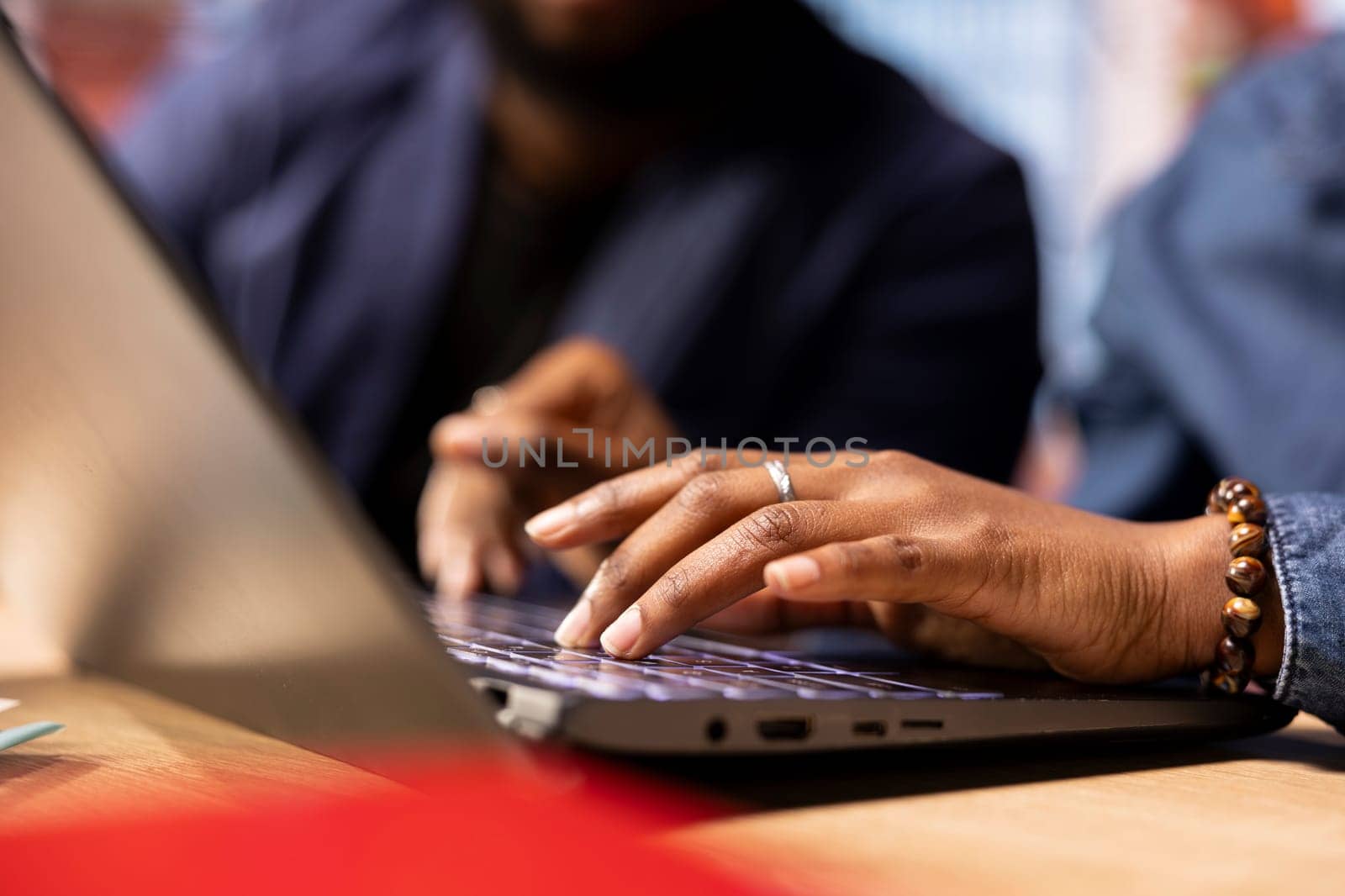 African American man and woman at home office analyzes online business trends, using teamwork and technology to manage their freelance careers and boost tasks efficiency. Networking.