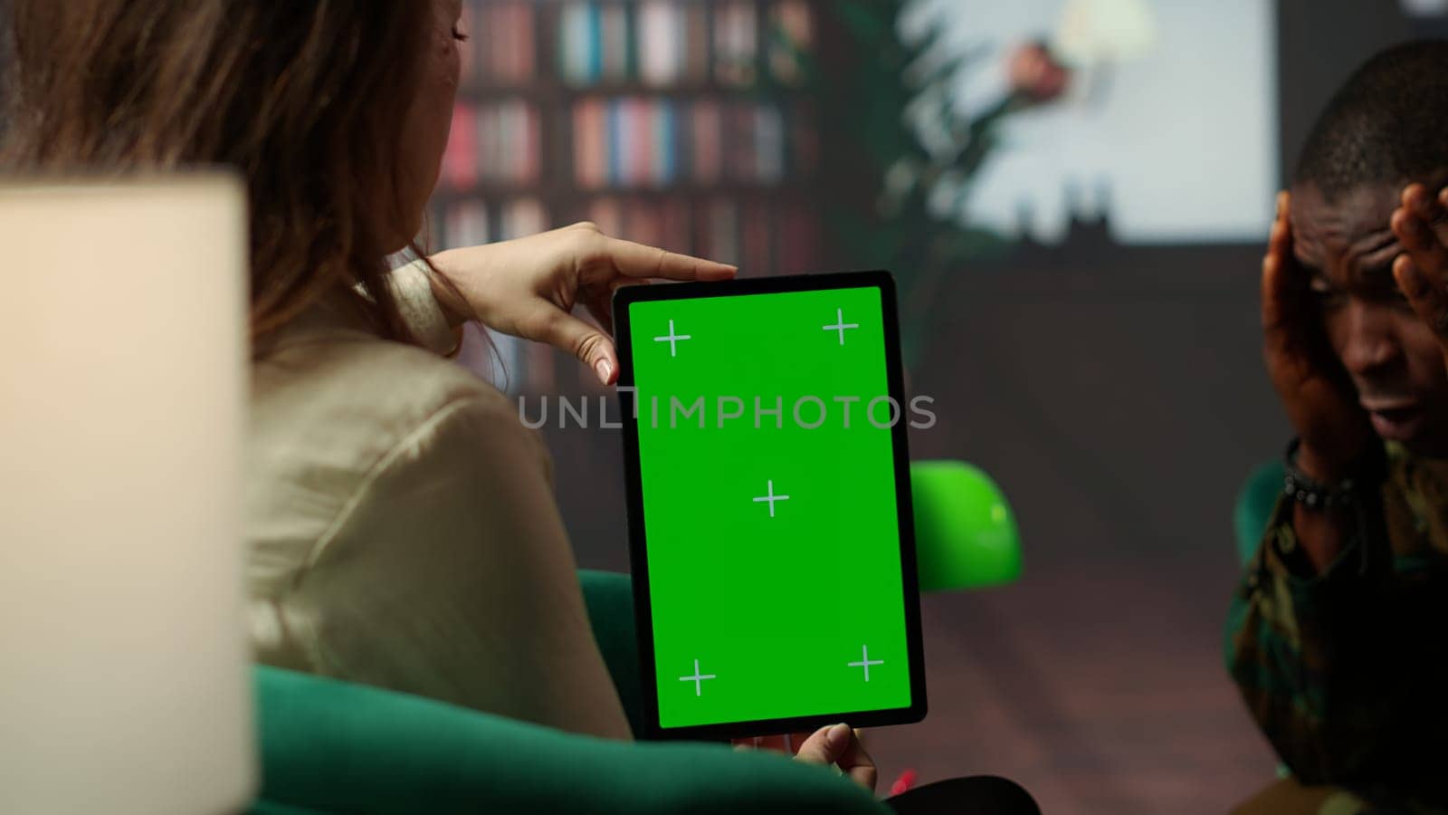 Psychotherapy session for a military veteran in distress with mockup screen, showcasing counseling support for PTSD and trauma after combat. Armed forces soldier with war flashbacks. Camera B.