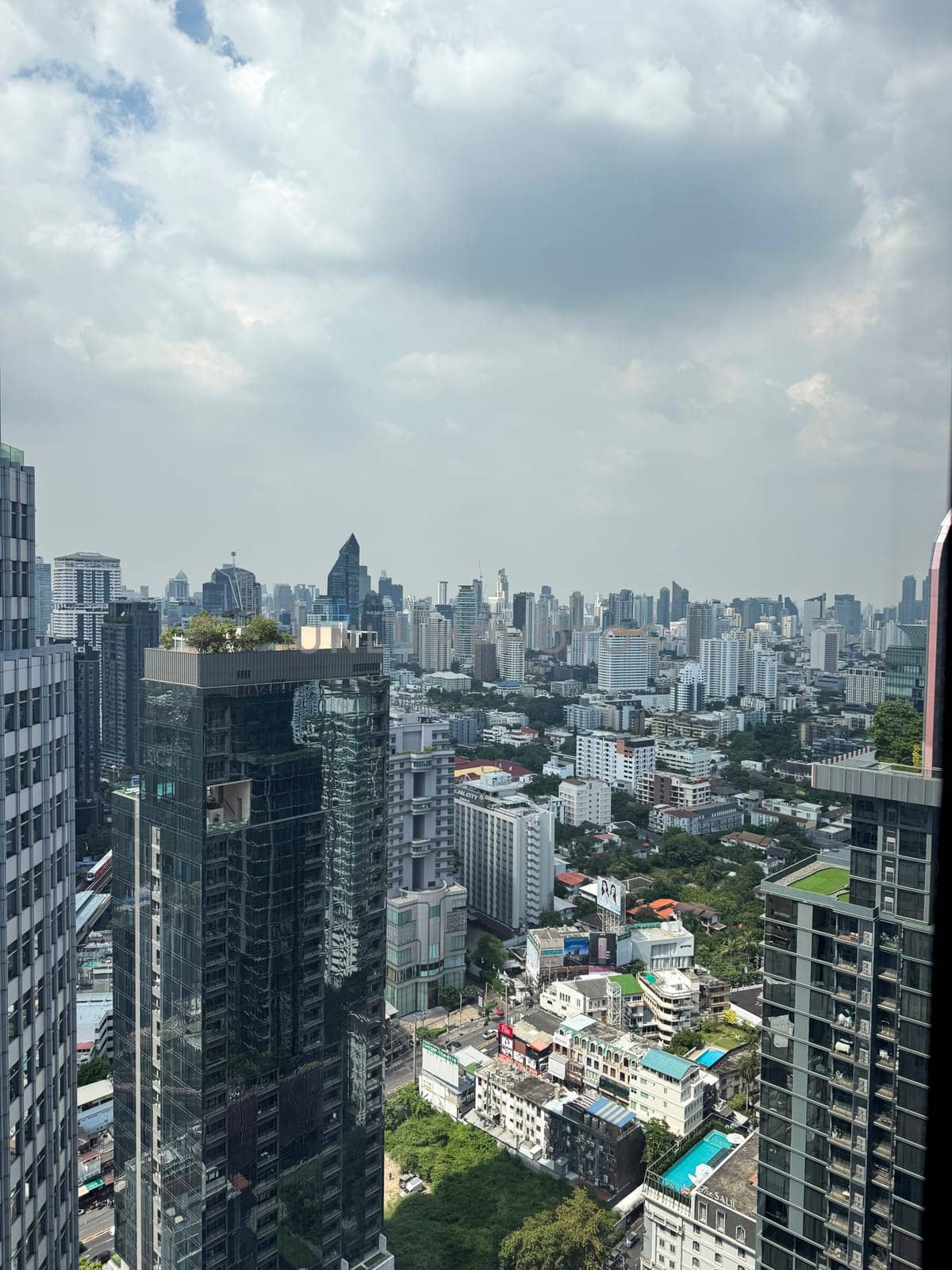 Thailand skyscrapers towers with big windows in the city center, downtown area with breathtaking office buildings and infrastructure. Urban landscape in the metropolis with towers.