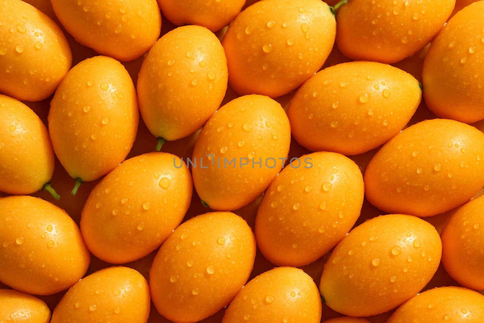AI generated top view of fresh ripe mayong chid with water droplets on smooth skin reflecting daylight for a clean vibrant and appetizing look