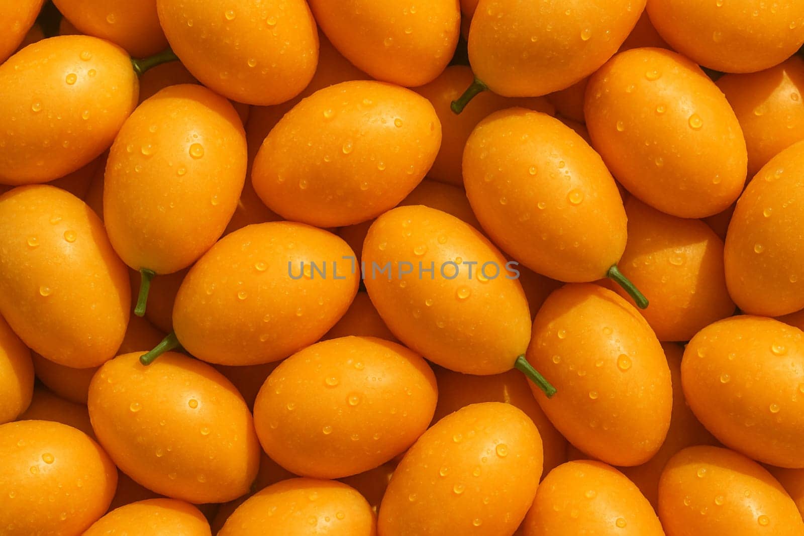 AI generated top view of ripe marian plums with water droplets under daylight showing freshness clean surface and vibrant tropical appeal