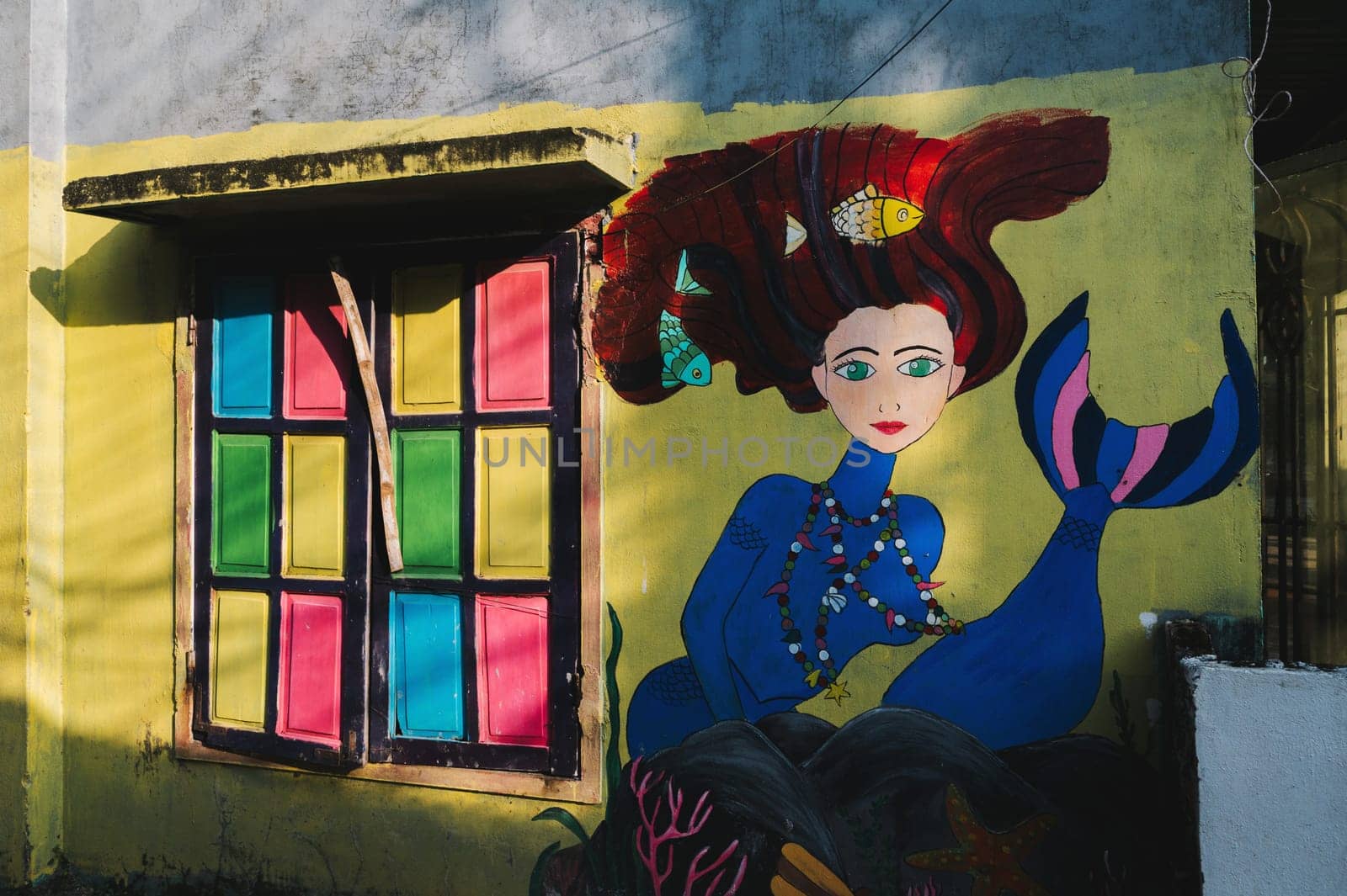Graffiti mermaid on the wall of house in Murals Paintings Fishing Village Tam Thanh in Quang Nam province in Vietnam. Tam Thanh, Quang Nam province, Vietnam - April 10, 2025