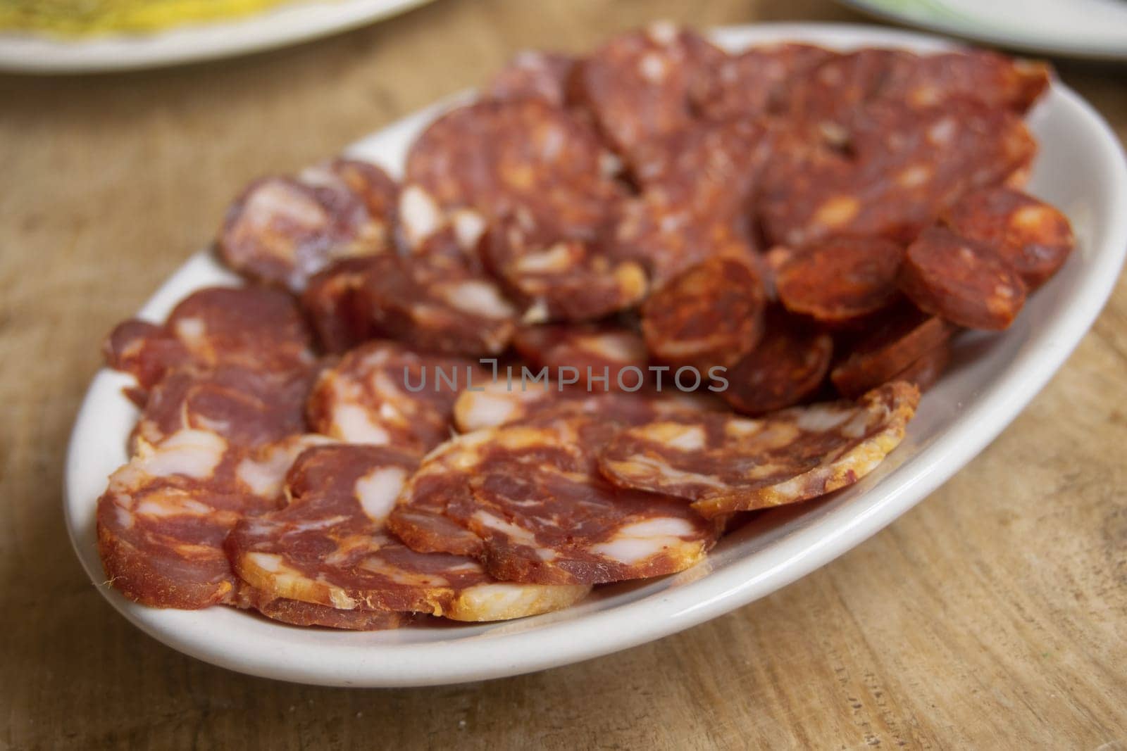 A close-up view of a delicious platter of assorted cured salami slices, perfect for an appetizer or charcuterie board