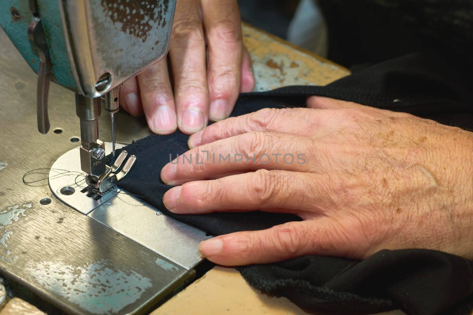 a person whose occupation is making fitted clothes such as suits, pants