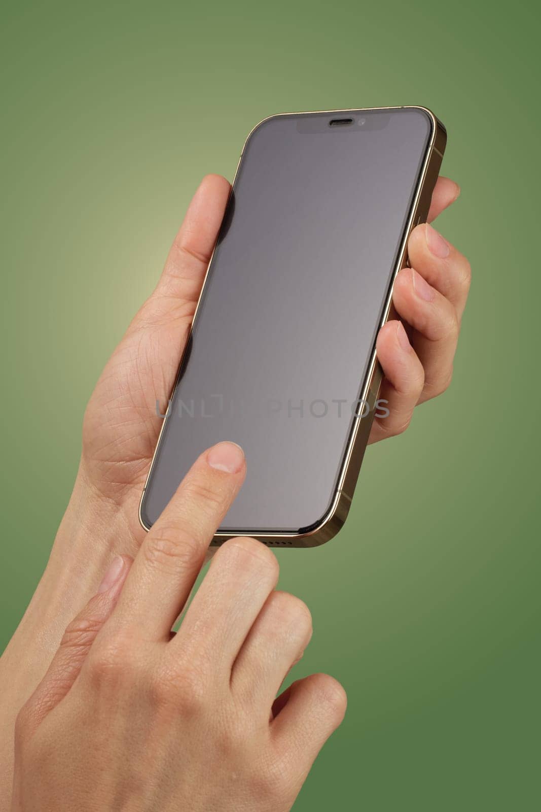 female hand holding and clicking , typing on smartphone screen isolated on green background, mockup , woman using smart phone