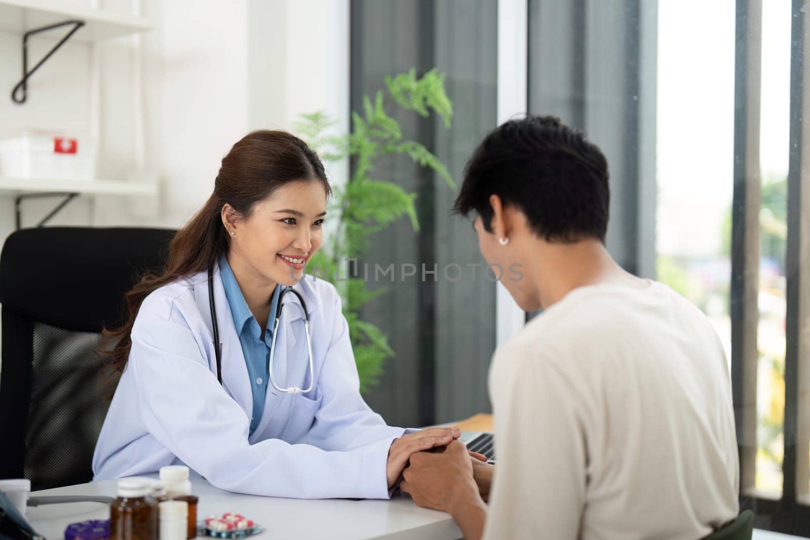 A smiling healthcare professional engages with a patient, creating a warm and inviting atmosphere for medical consultations.