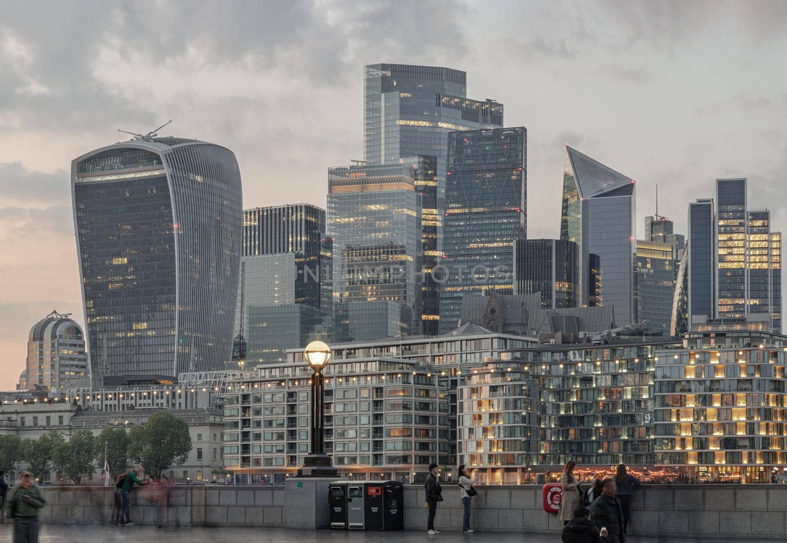 London, UK - Apr 27, 2025 - The Picturesque view of The Skyscrapers of Financial District by River Thames after sunset in City of London. use it as your Wallpaper, Poster and Copy space. Selective focus.