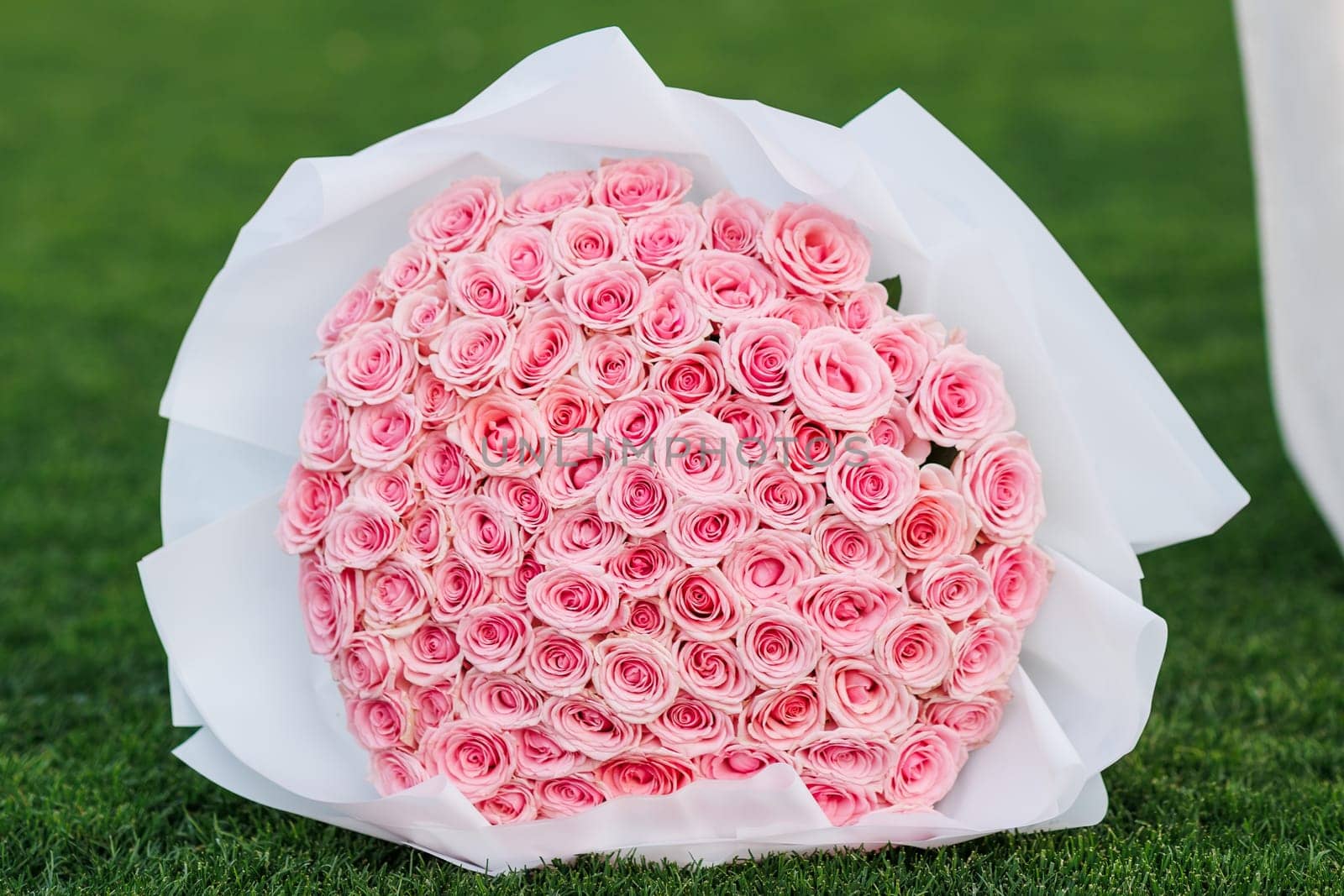 bouquet of roses on the lawn of the football field. High quality photo
