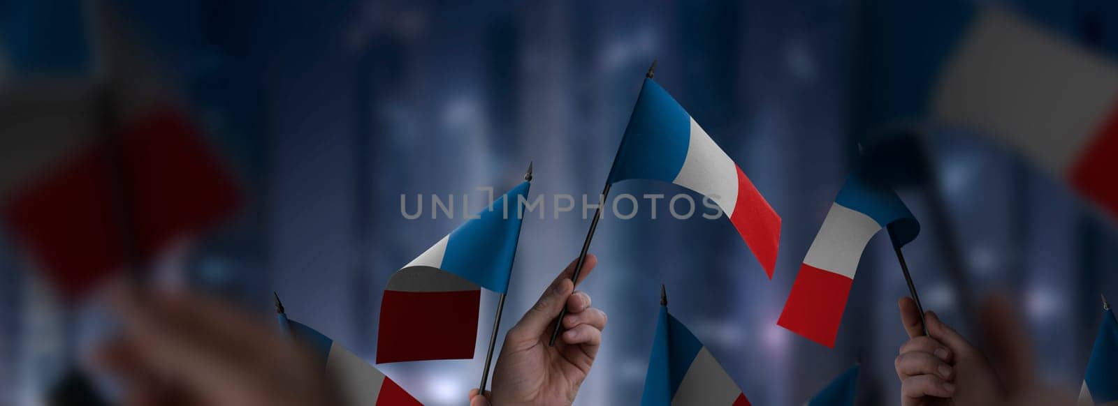 France flags in their hands on a blurred urban background. The photo illustration was created without the use of artificial intelligence, only using Photoshop.