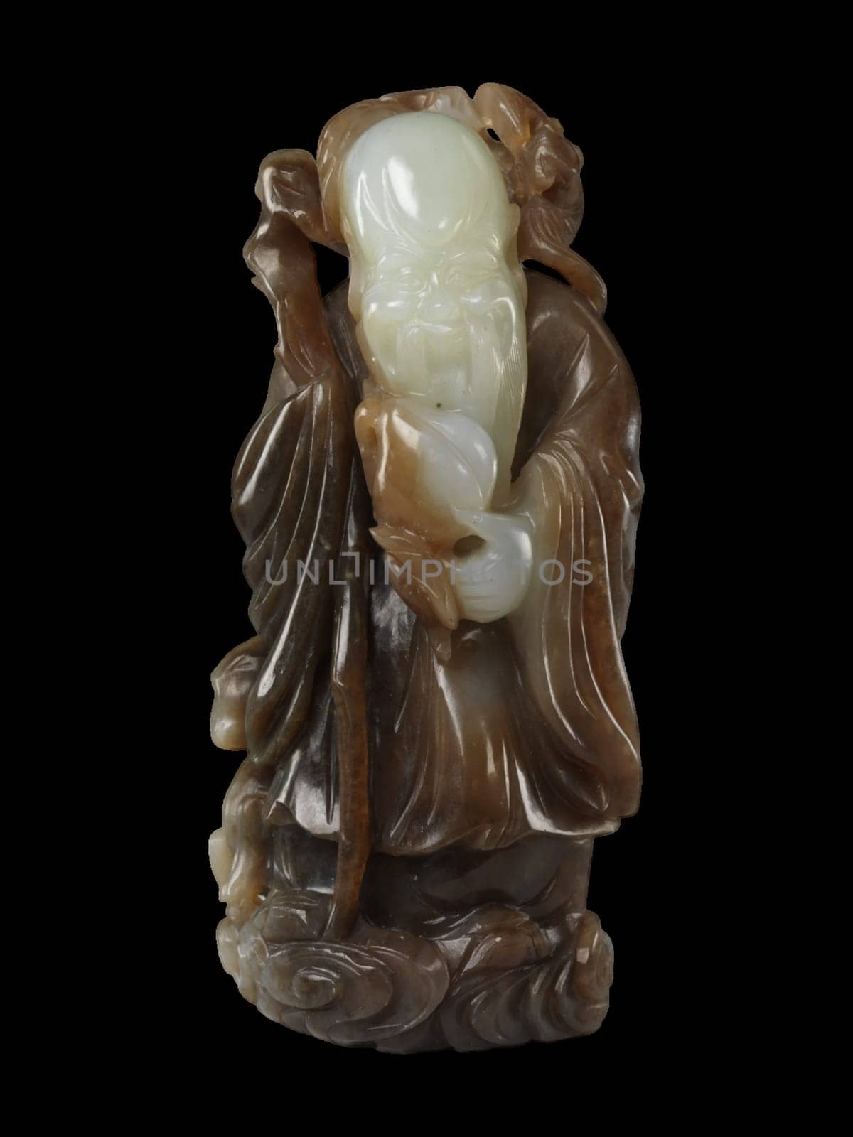 19th-century Chinese carving of Shoulao, the God of Longevity, in variegated jade. Holds a staff and peach, symbols of long life.