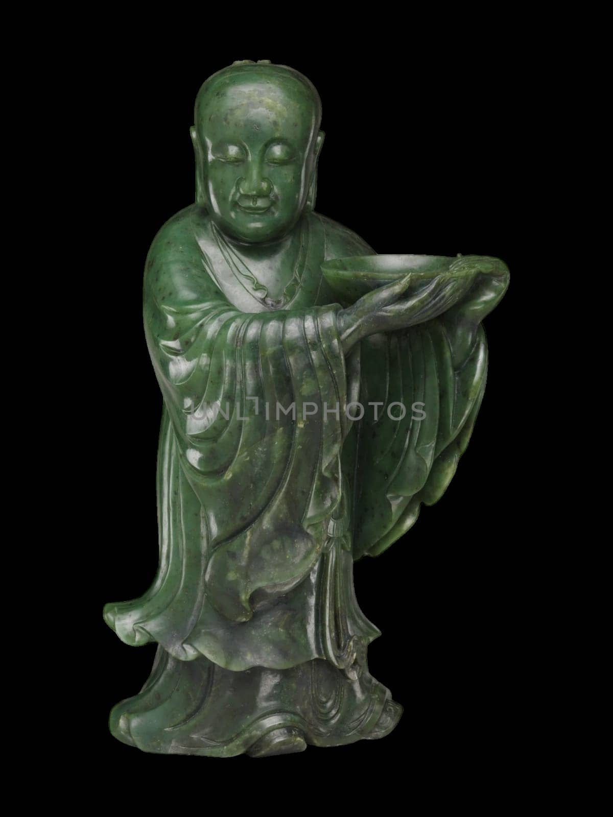 18th-century Chinese carving of a standing immortal figure in deep green jade, holding an offering. Smooth texture, serene expression.