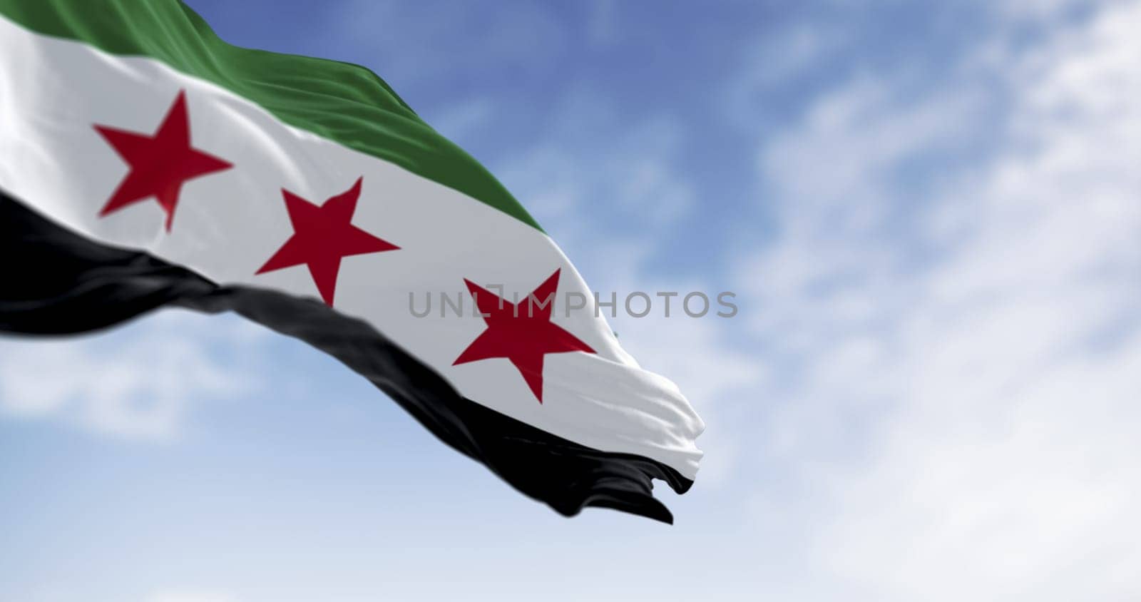 Syria national flag waving on a clear day. Horizontal tricolor green, white, black, three red five-pointed stars. 3d illustration render. Selective focus