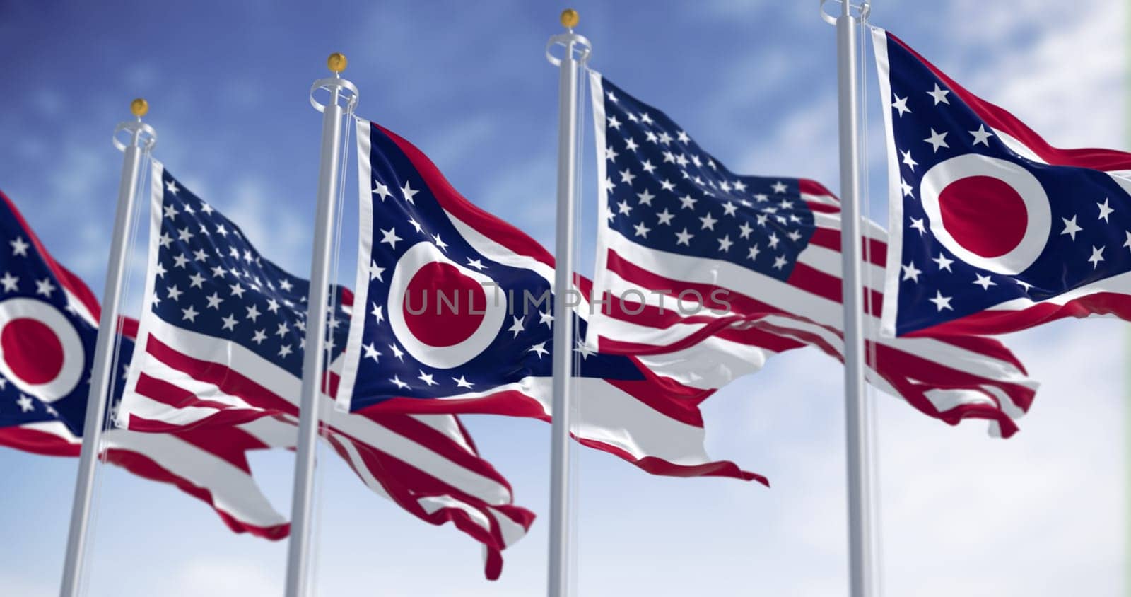 Ohio state flag waving in the wind with the national US flag on a clear day. 3D illustration render. Rippled textile. Selective focus