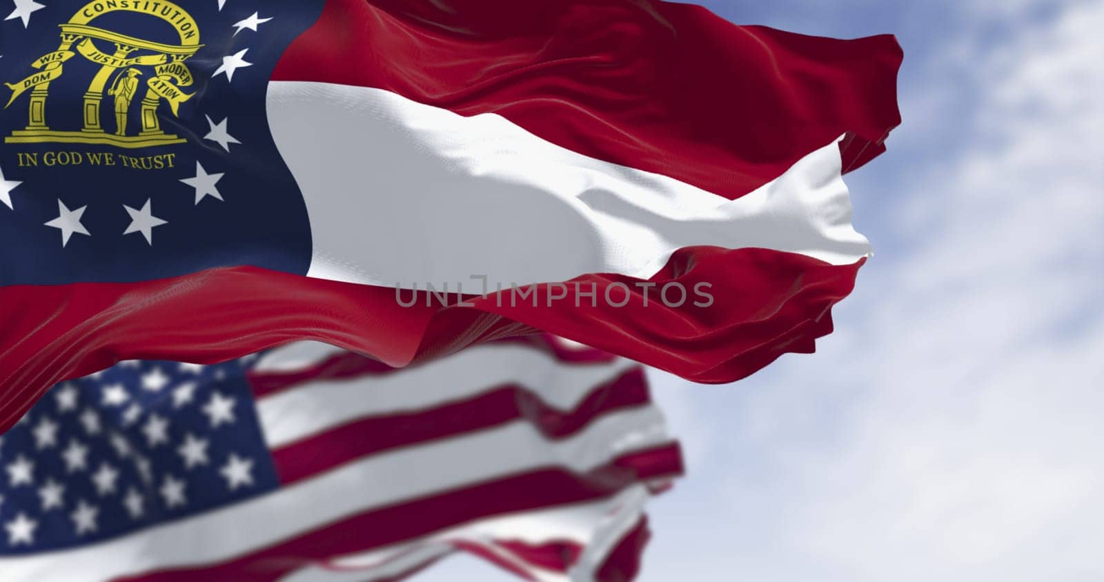Flags of Georgia and United States waving in the wind on a clear day. Georgia is a state in the southeastern US. US federate state. 3d illustration render. Fluttering textile